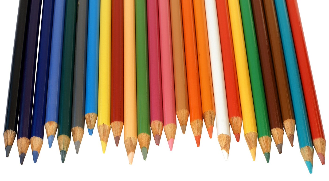 Real photograph of colored pencils arranged on a light background