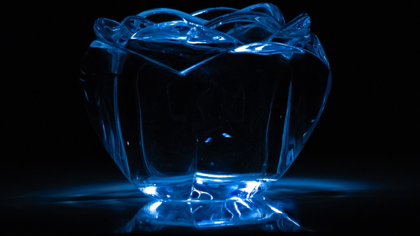 A crystal candle holder catching light