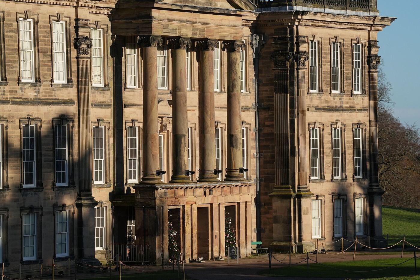 Sunlight falling across the main doorway of Calke Abbey