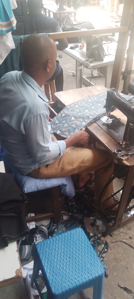 A person preparing fabric for mending