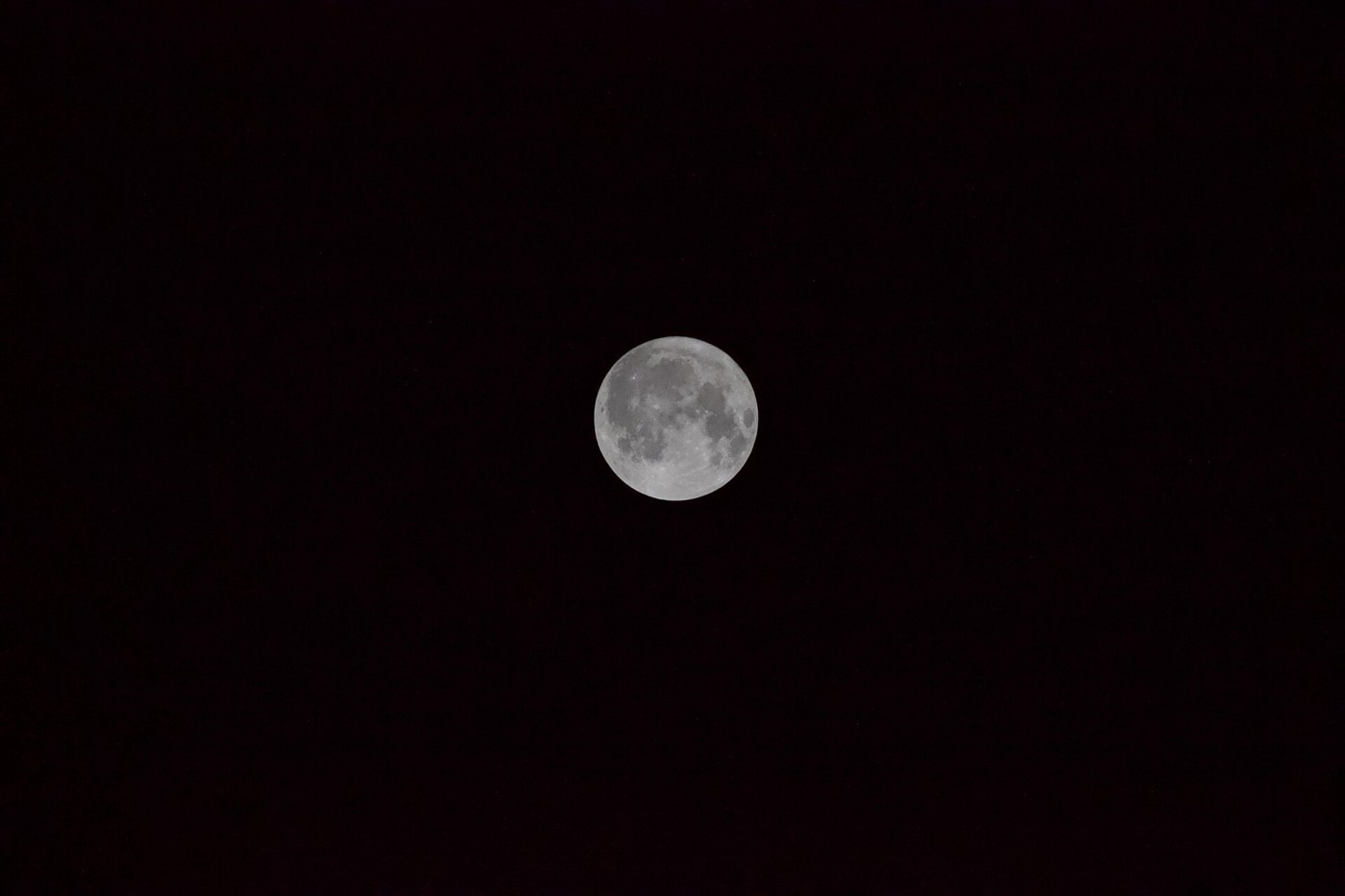 Full moon photographed against a dark night sky