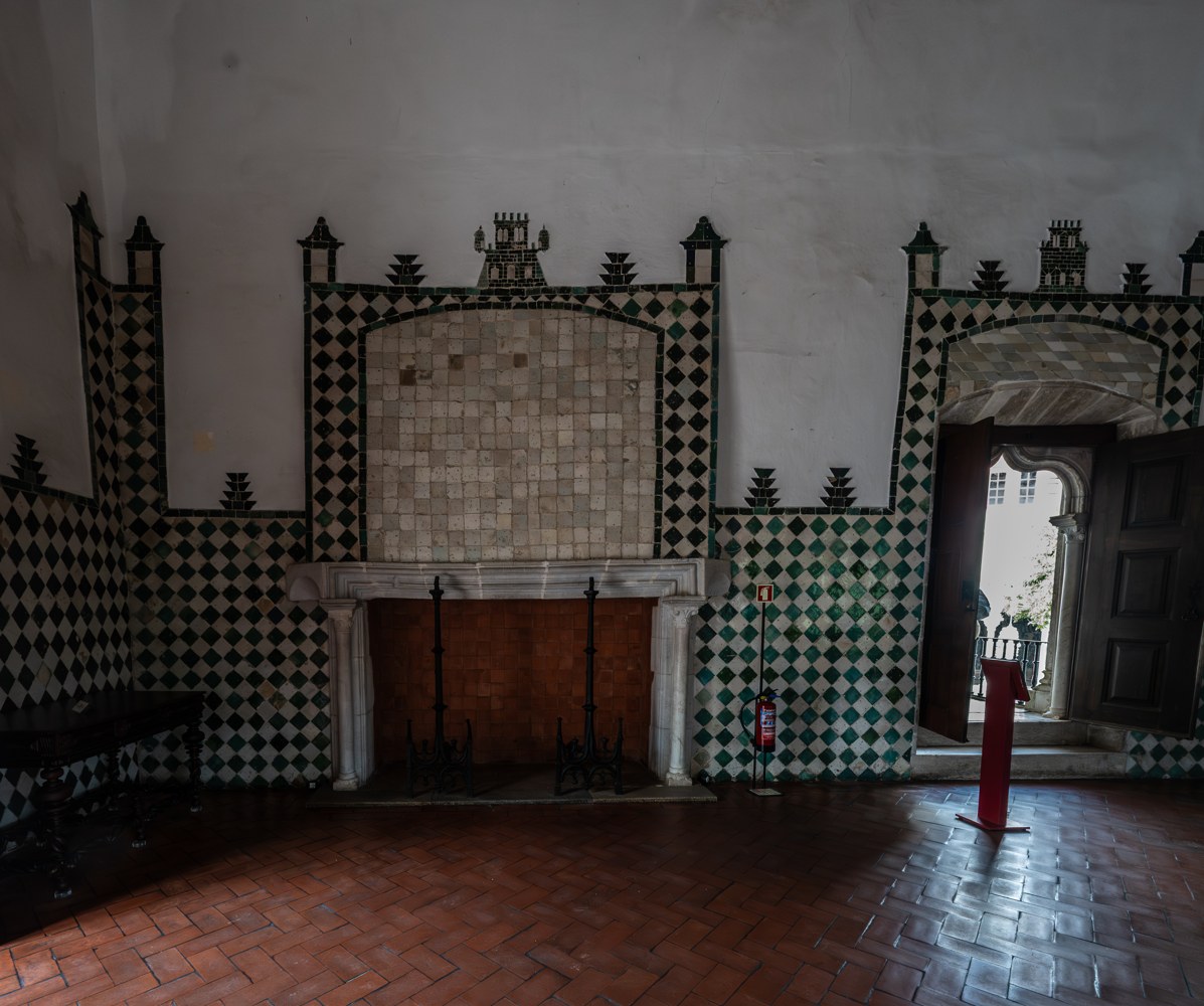 Grand Tiled Room with Ornate Fireplace and Wooden Doors (55253582706)