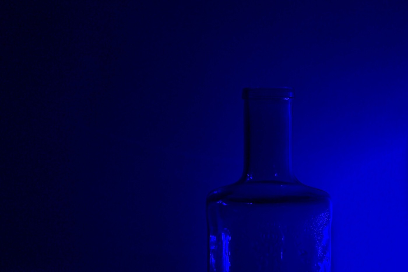 Light and blue glass in a close-up photograph