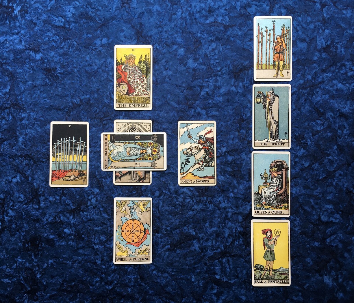 Physical tarot cards arranged in a Celtic cross spread